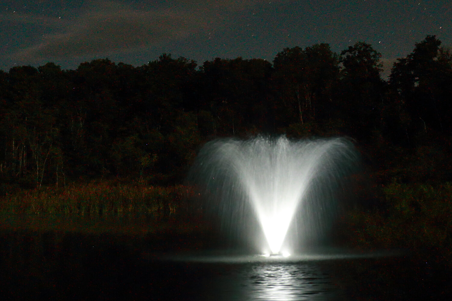 One of Otterbine's Aerating Fountains with Fountain Glo™ High Voltage Lighting