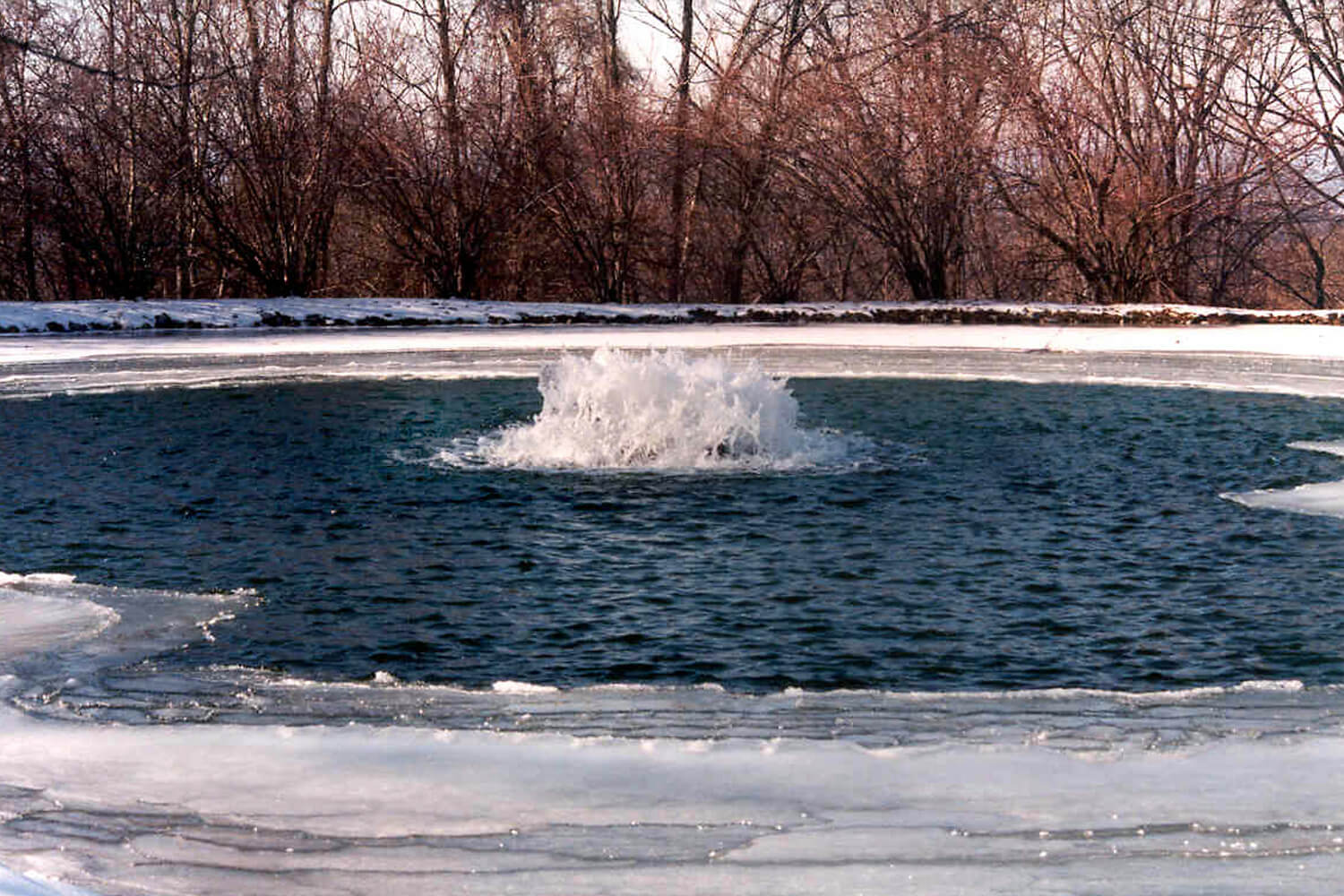An Otterbine Industrial Pond Aerator and Circulator in winter