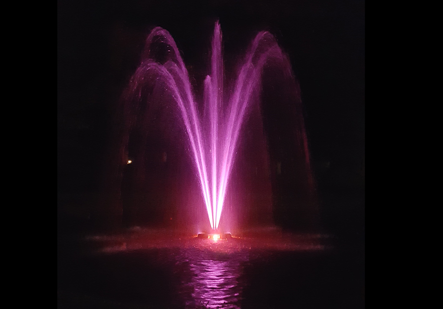 One of Otterbine's Aerating Fountains with Fountain Glo™ High Voltage Lighting